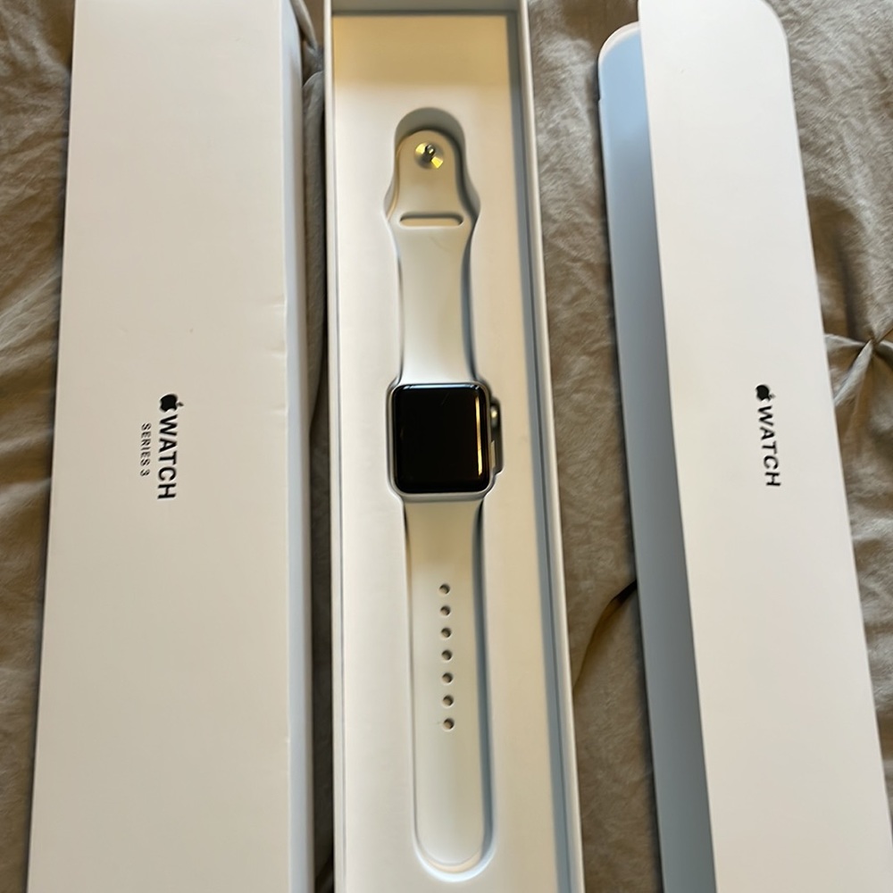 Apple Watch Series 3 38mm with screen protectors, bumpers, bands, and charger